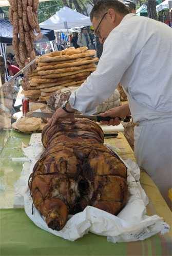 slicing a porchetta