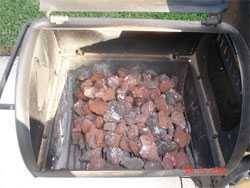 lava rocks in a modified smoker to distribute heat