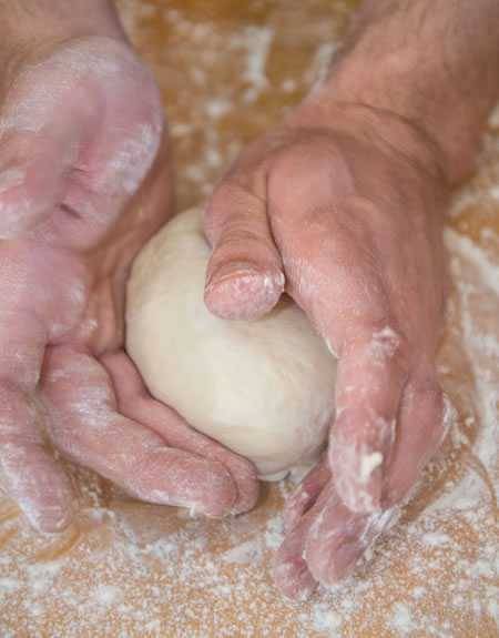 shaping pizza dough ball