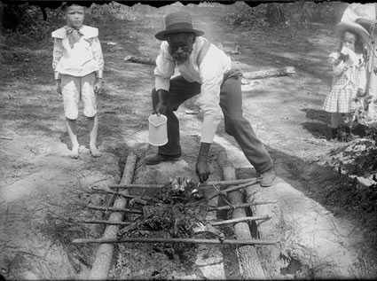 pitmaster cooking on an open pit barbecue