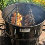 pit barrel cooker with meat hanging