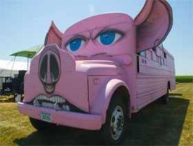 Bus tricked out like a pink pig