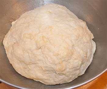 pizza dough in mixing bowl