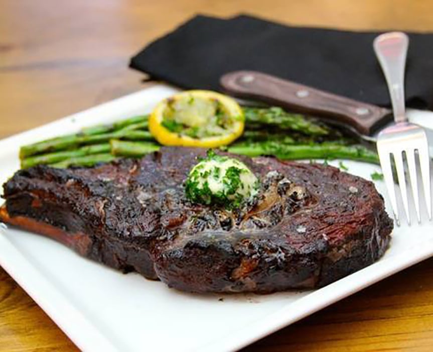 ribeye steak with butter and asparagus