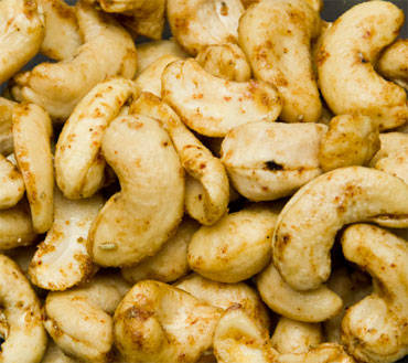 A pile of lightly glazed cashews