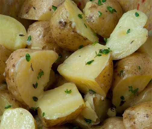 Small potatoes embellished with parsley and butter