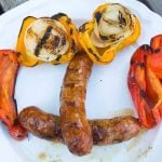 sausage and peppers on white plate