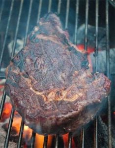 ribeye smoking on grill