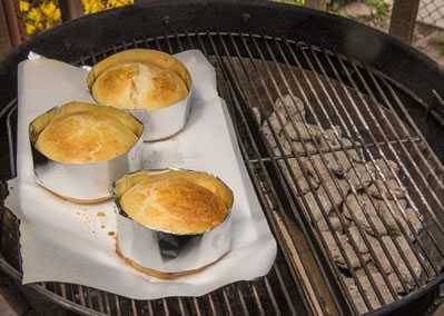 Brioche buns baking on a grill