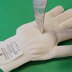 image of a knife stabbing a glove