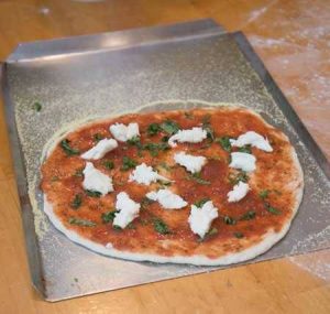 pizza with toppings on pan