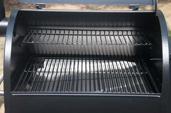 Grill with lid up showing cooking grates.