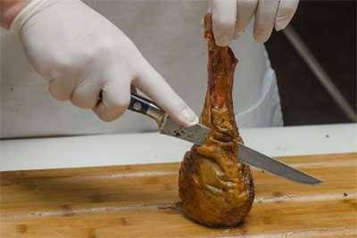 carving meat off a turkey leg