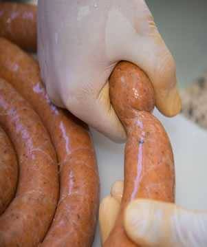 twisting the sausage into links