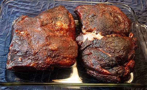 Smoked pork butts an a glass tray