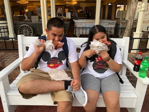 two people enjoying turkey legs