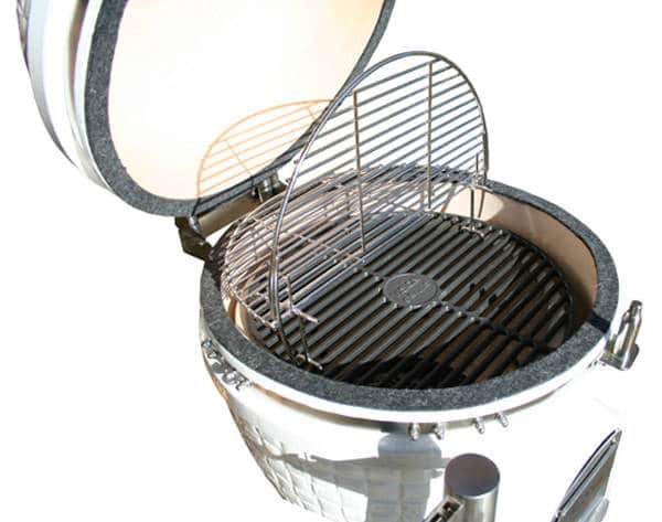 round white kamado with lid up showing shiny steel rod cooking grates.