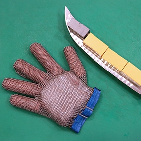 image of a glove and a knife with magnetic weights attached