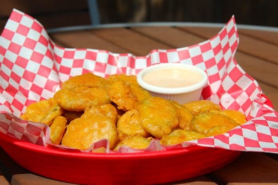 Deep fried pickles served with a side of ranch dressing