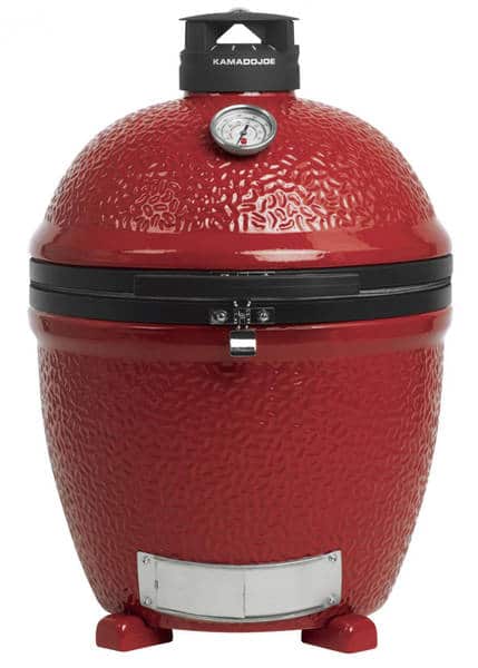 Red kamado placed on a floor with no stand.