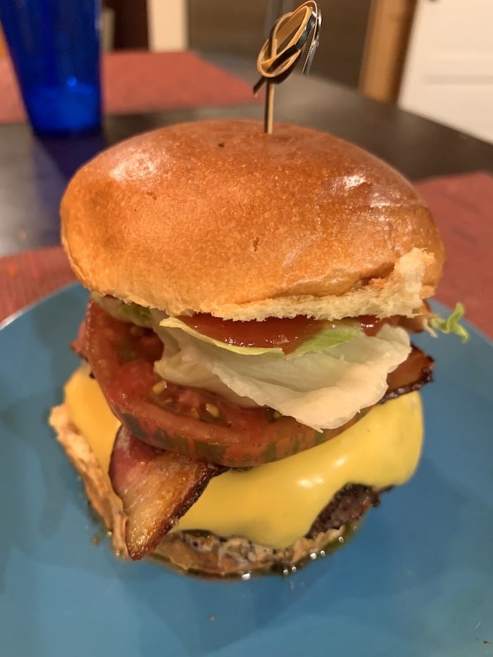 bacon cheeseburger on plate