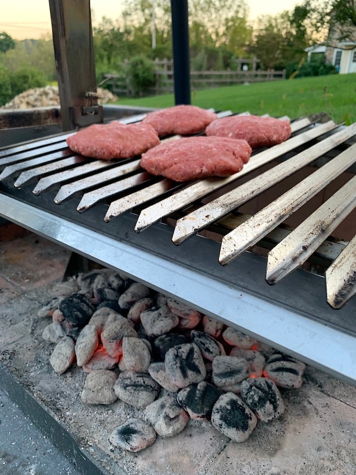 burgers over charcoal briquets