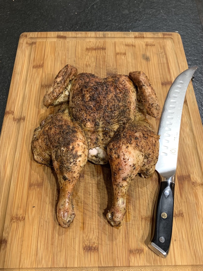 roasted spatchcocked chicken on cutting board