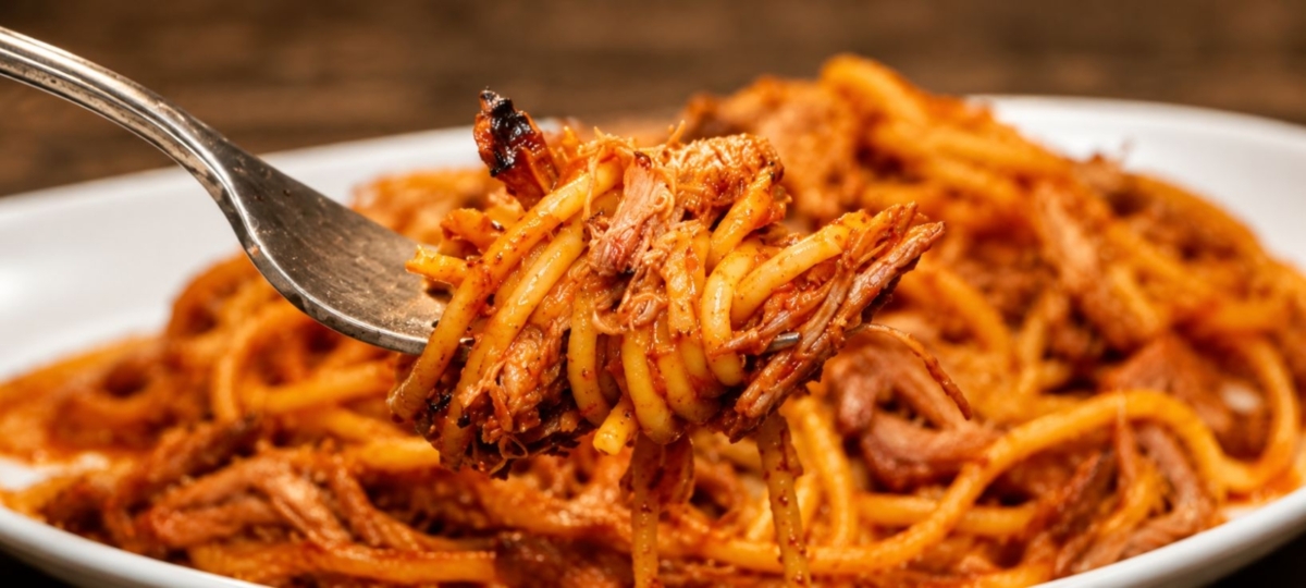 BBQ spaghetti on a fork and in a bowl.