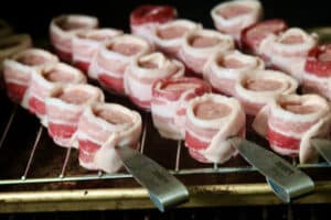 uncooked bacon wrapped kielbasa.
