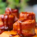 BBQ sauce drizzlied bacon wrapped sausage bites