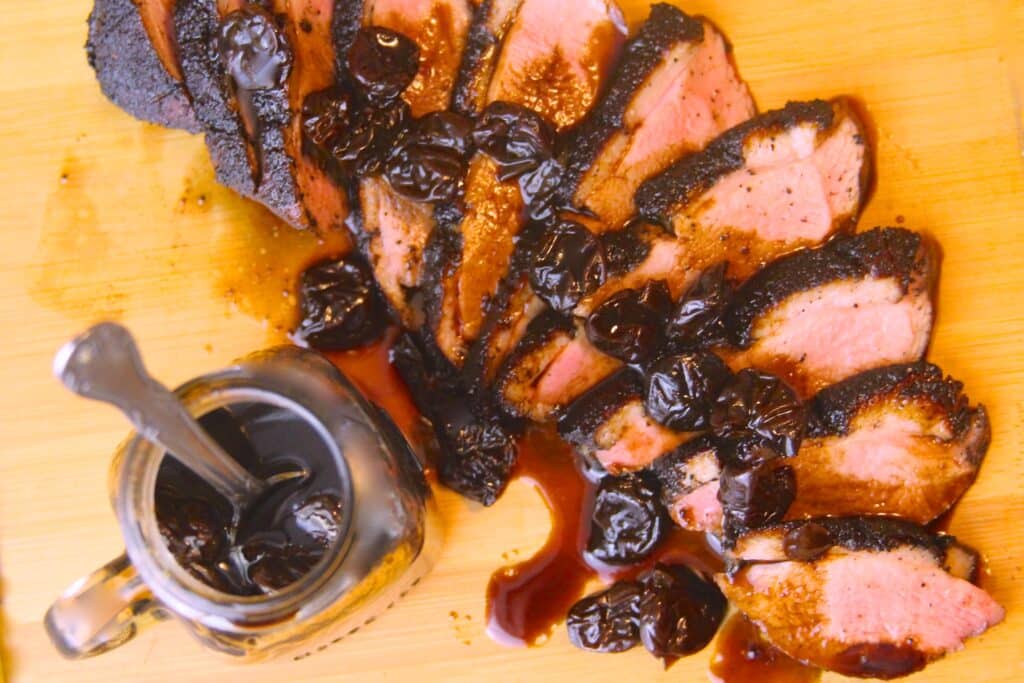 Sliced duck breast with balsamic-cherry reduction