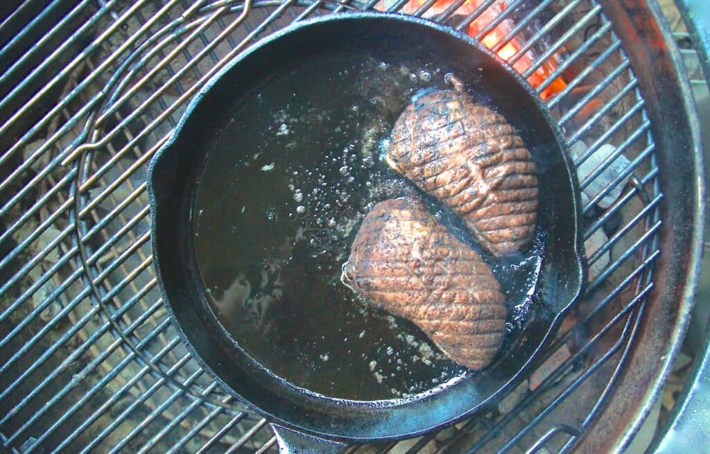 Duck breast searing in a pan