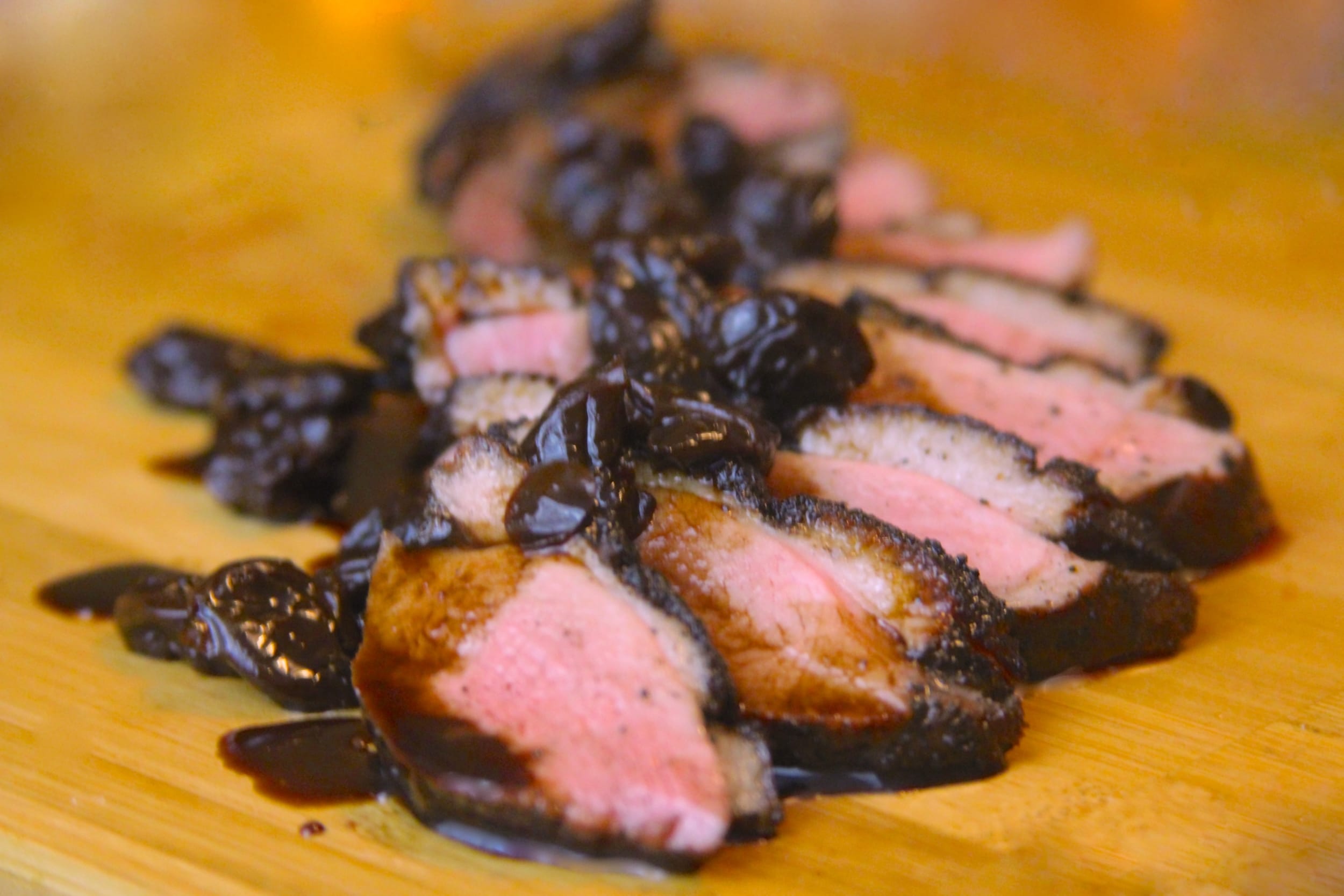 Sliced duck breast with balsamic-cherry sauce