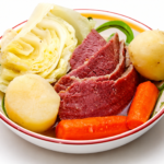 Corned beef, cabbage, potatoes and carrots in a bowl