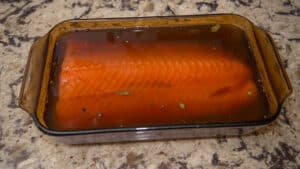 Pan of salmon soaking in brine.