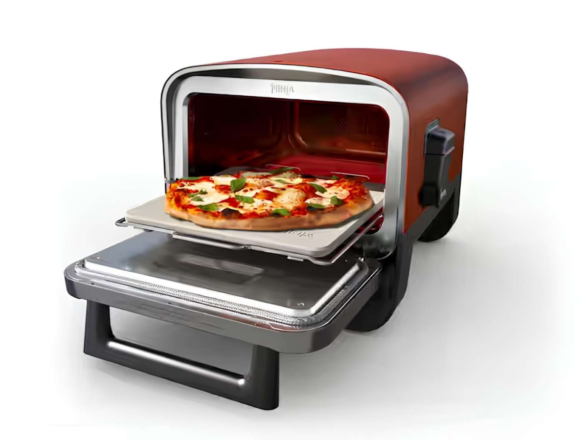 Ninja Woodfire 8-in-1 Outdoor Oven with a cooked pizza.