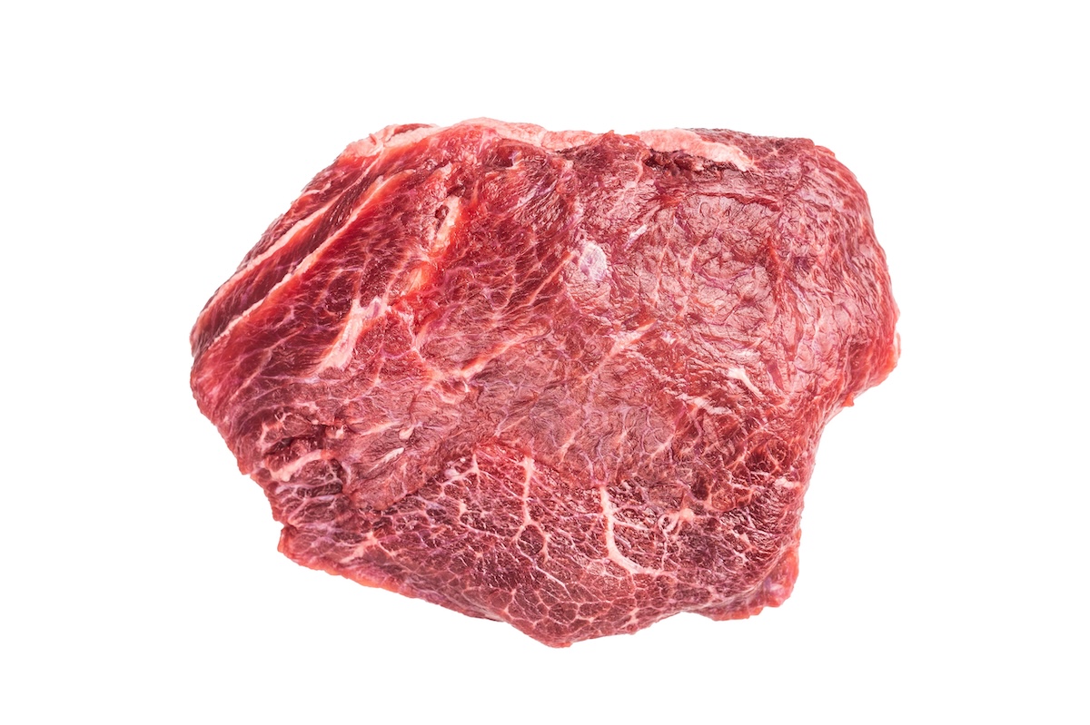 raw beef cheek on a white background.