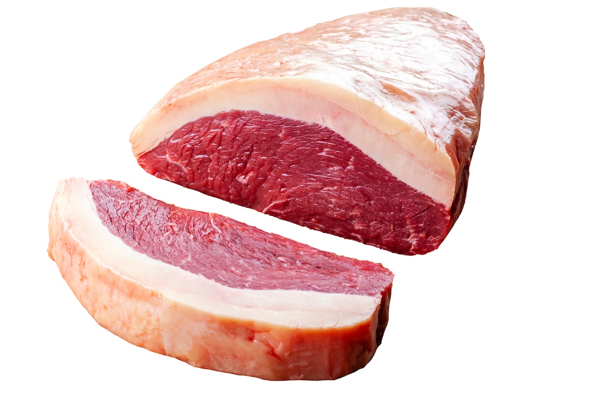 raw picanha (coulotte, sirloin cap, rump cap) cut to show thick fat cap.