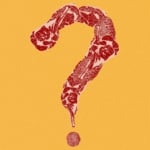 pieces of red meat arranged in the shape of a question mark.
