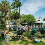 Various smokers arranged on a grass lawn