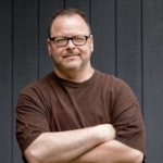 Ray Sheehan standing with arms folded across his chest
