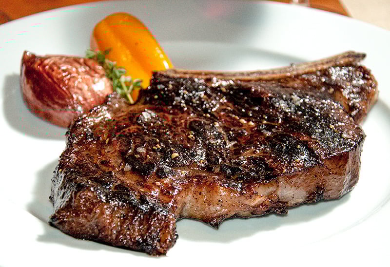 A plate of steak and vegetables

AI-generated content may be incorrect.