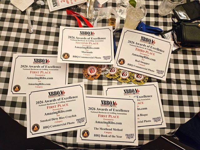 National Barbecue & Grilling Association Awards for AmazingRibs.com spread out on a table.