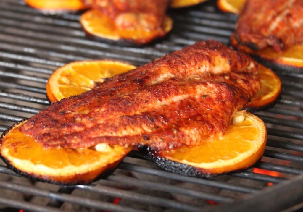 Catfish grilling on citrus