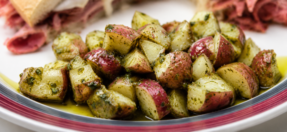 Pesto potato salad on a plate.