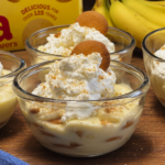 Banana pudding in glass bowls topped with whipped cream