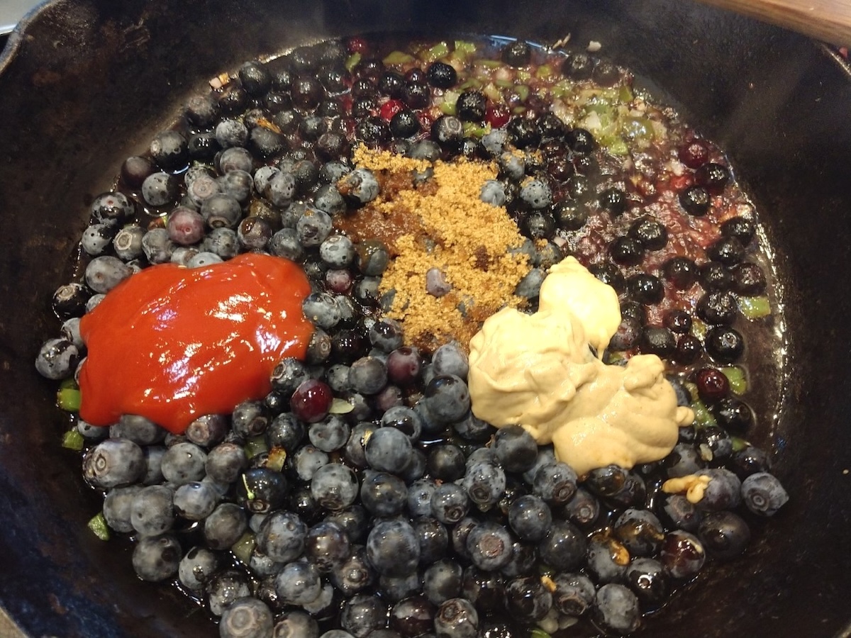 Blueberry BBQ sauce recipe in process showing all ingredients in a bowl.