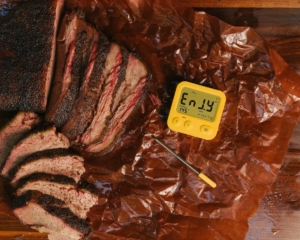 Hot and fast brisket sliced on butcher paper with Combustion Predictive Thermometer.