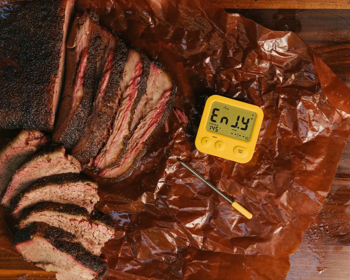 Hot and fast brisket sliced on butcher paper with Combustion Predictive Thermometer.