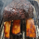Texas beef short ribs on a smoker.
